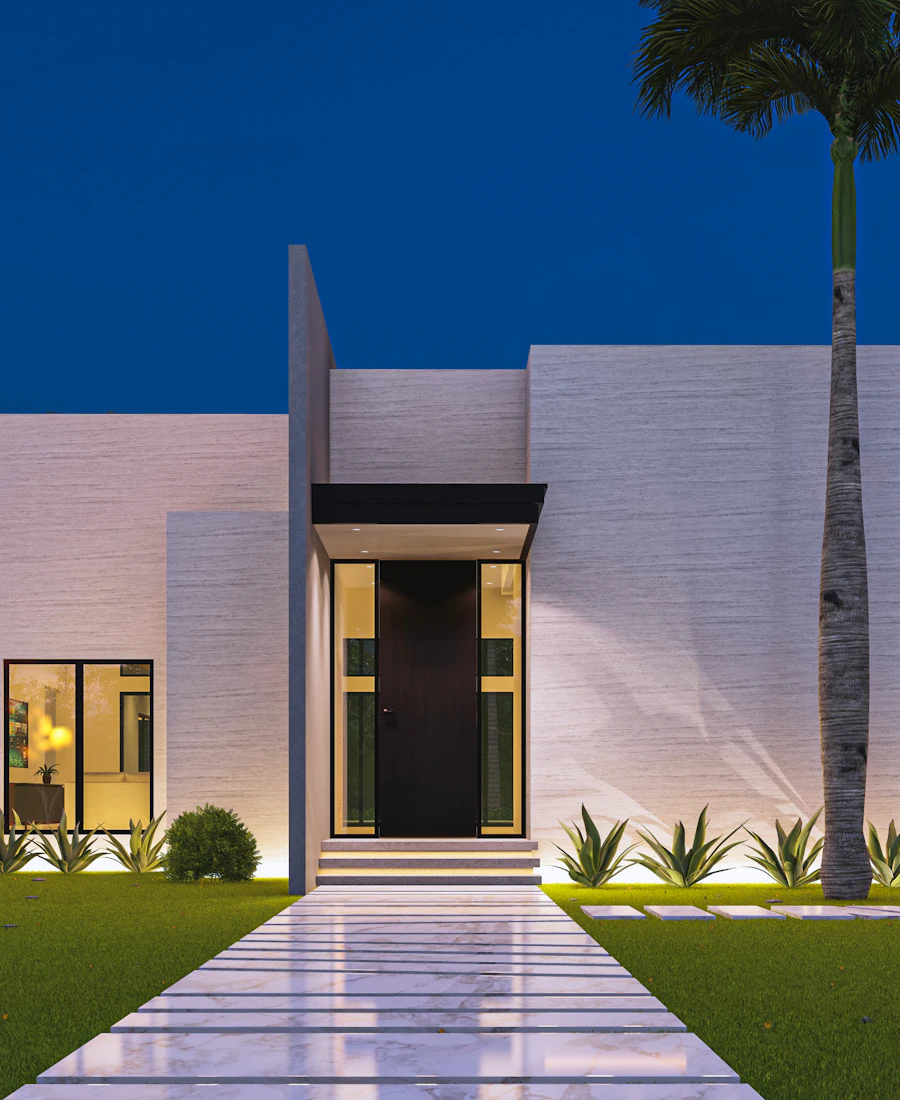 Gece aydınlatmalı beyaz modern konut ve giriş yolu